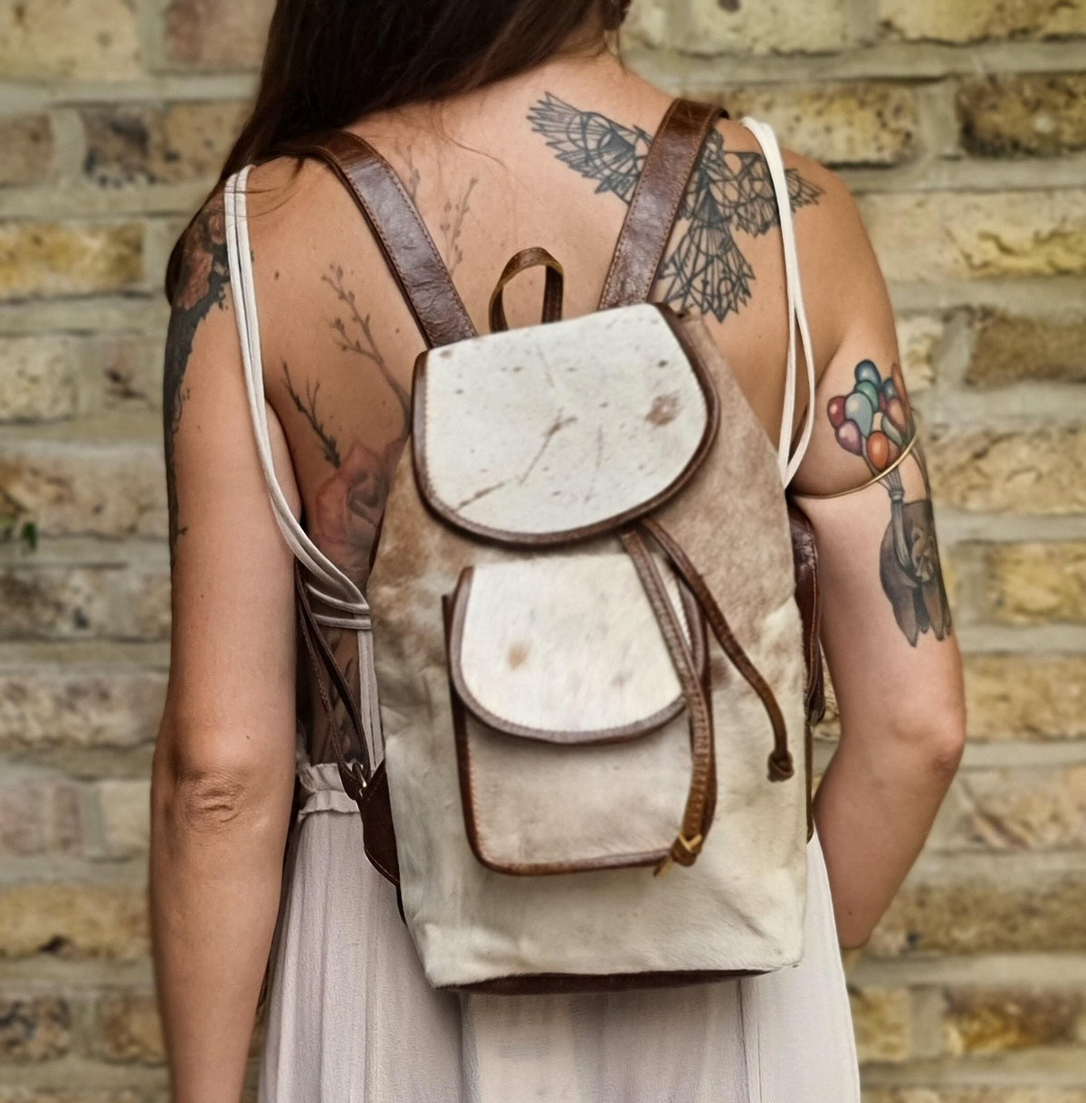 Cowhide Leather Backpack – Small Western Rucksack with Cow Print, Fringe & Conchos