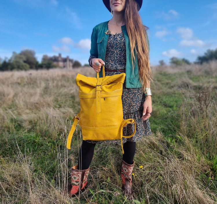 Large roll top leather backpack for women in minimalist design - practical versatile travel rucksack