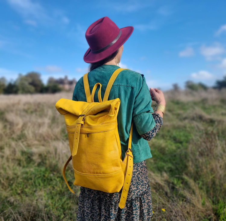 Large roll top leather backpack for women in minimalist design - practical versatile travel rucksack