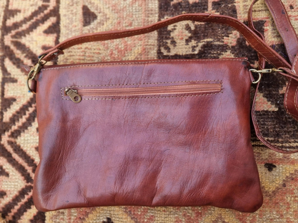 Studded Leather Envelope Clutch: Moroccan Crossbody Bag with Rising Sun