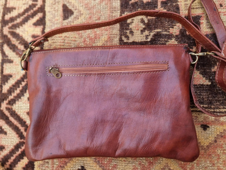 Studded Leather Envelope Clutch: Moroccan Crossbody Bag with Rising Sun