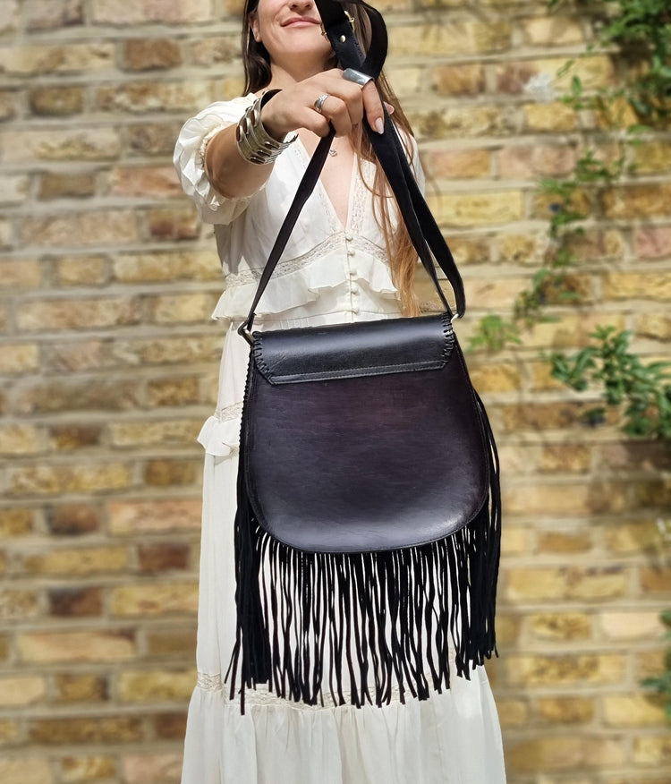 Handcrafted floral tooled leather bag with fringe - boho chic style