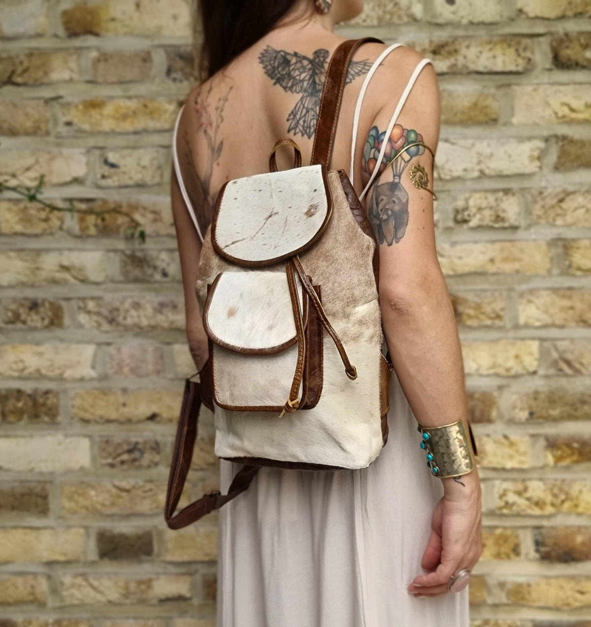 Cowhide Leather Backpack – Small Western Rucksack with Cow Print, Fringe & Conchos
