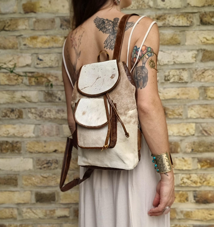 Cowhide Leather Backpack – Small Western Rucksack with Cow Print, Fringe & Conchos