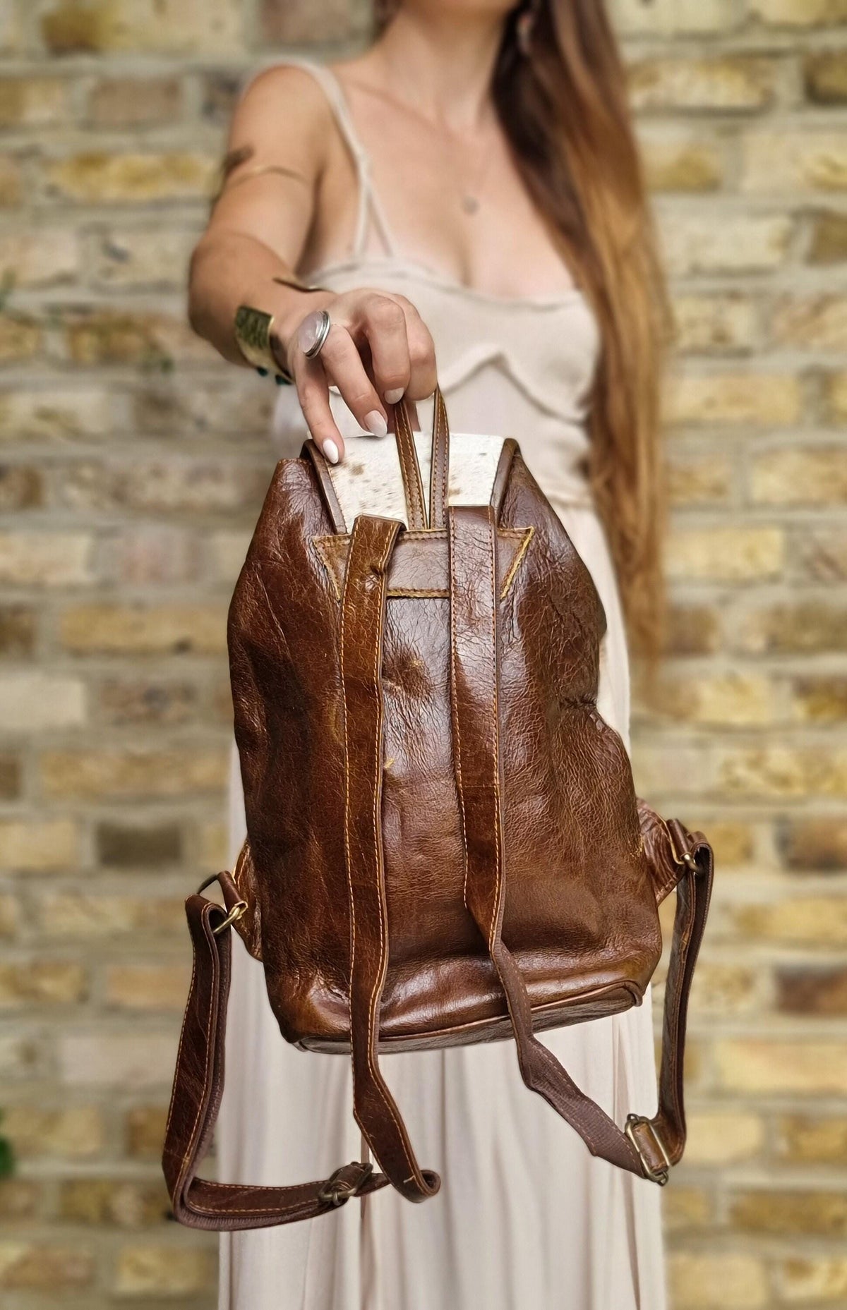 Cowhide Leather Backpack – Small Western Rucksack with Cow Print, Fringe & Conchos