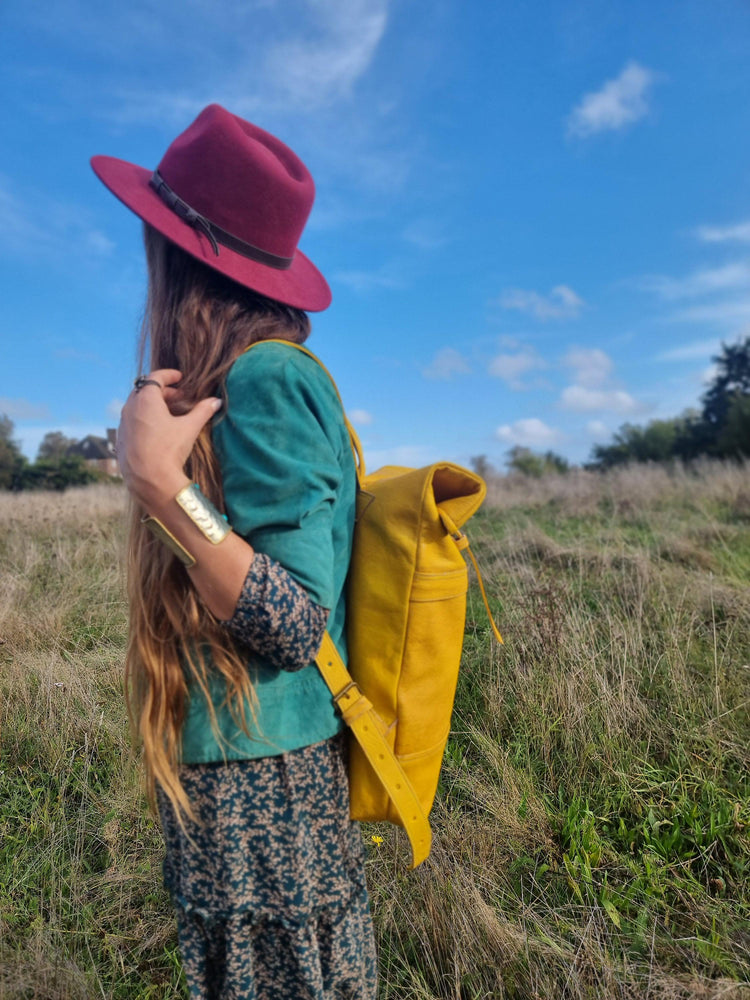 Large roll top leather backpack for women in minimalist design - practical versatile travel rucksack