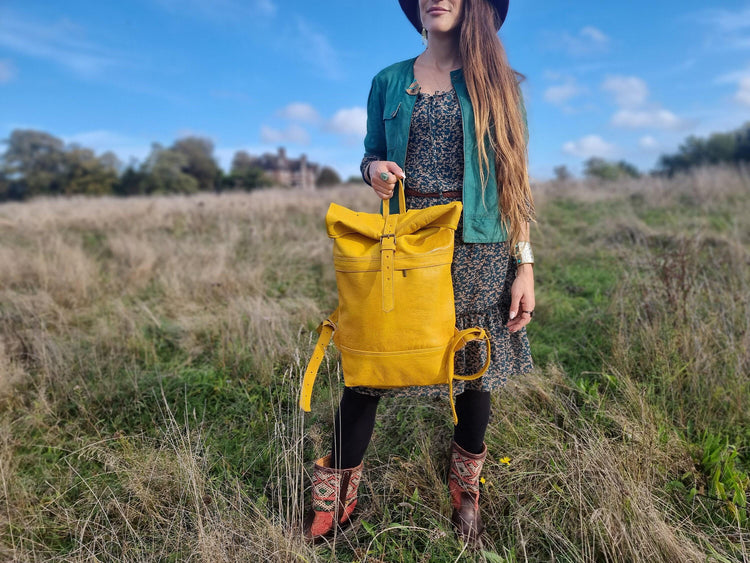 Large roll top leather backpack for women in minimalist design - practical versatile travel rucksack