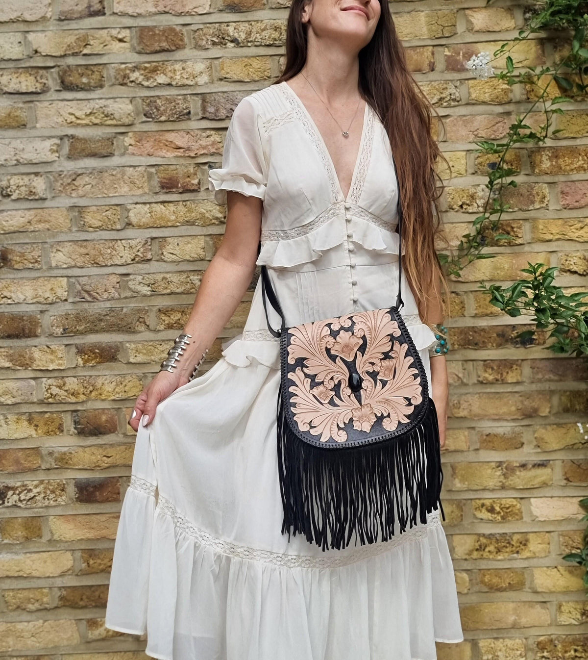 Handcrafted floral tooled leather bag with fringe - boho chic style