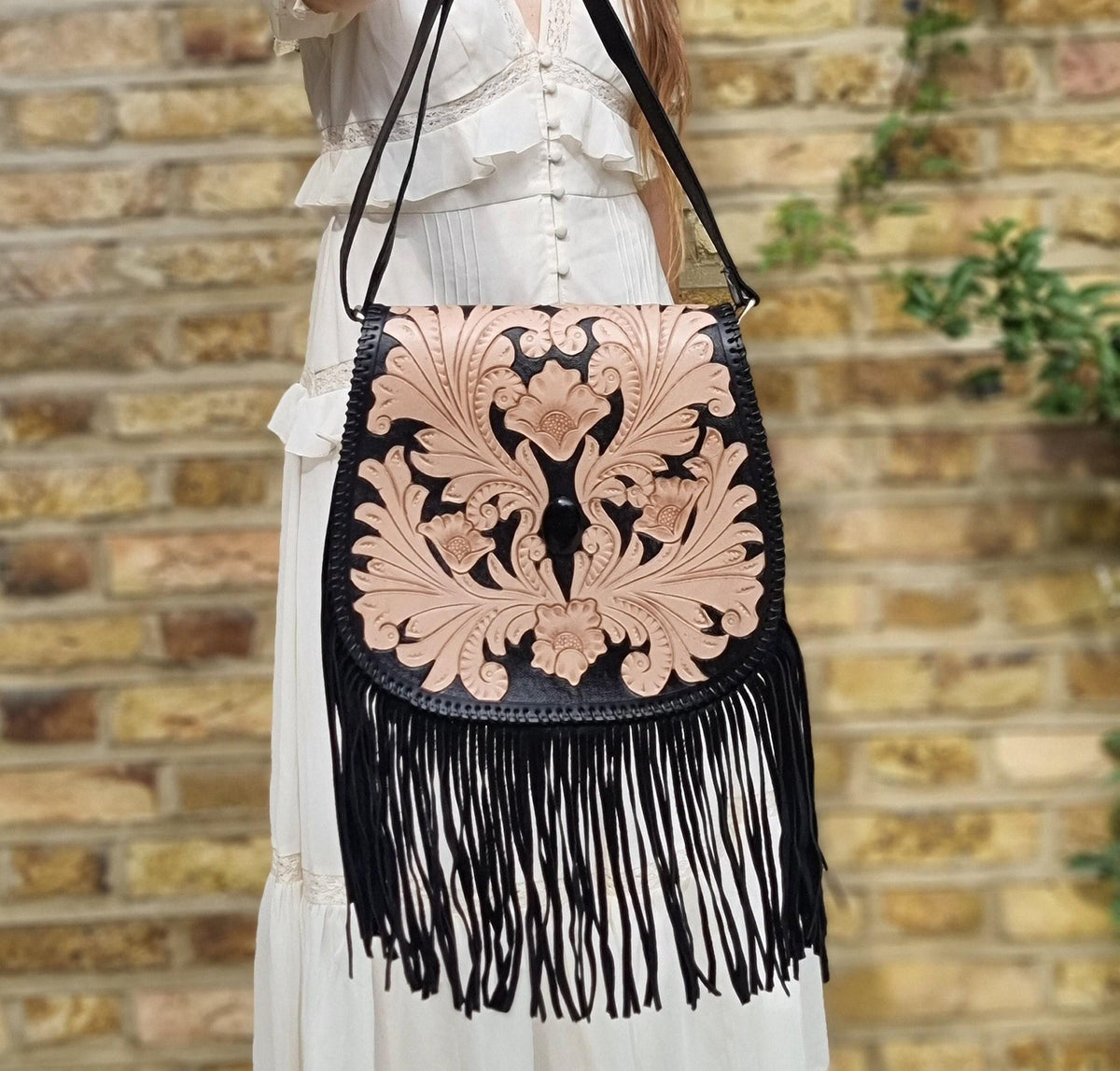 Handcrafted floral tooled leather bag with fringe - boho chic style