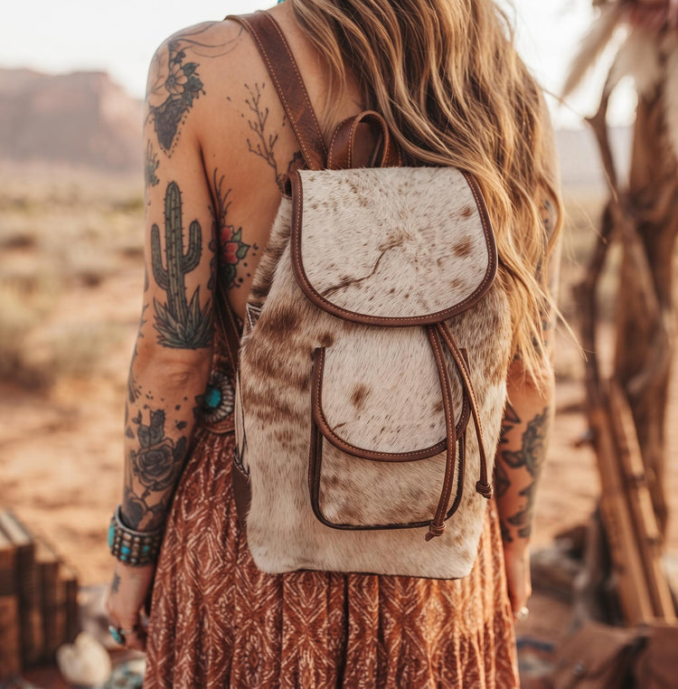 Cowhide Leather Backpack – Small Western Rucksack with Cow Print, Fringe & Conchos